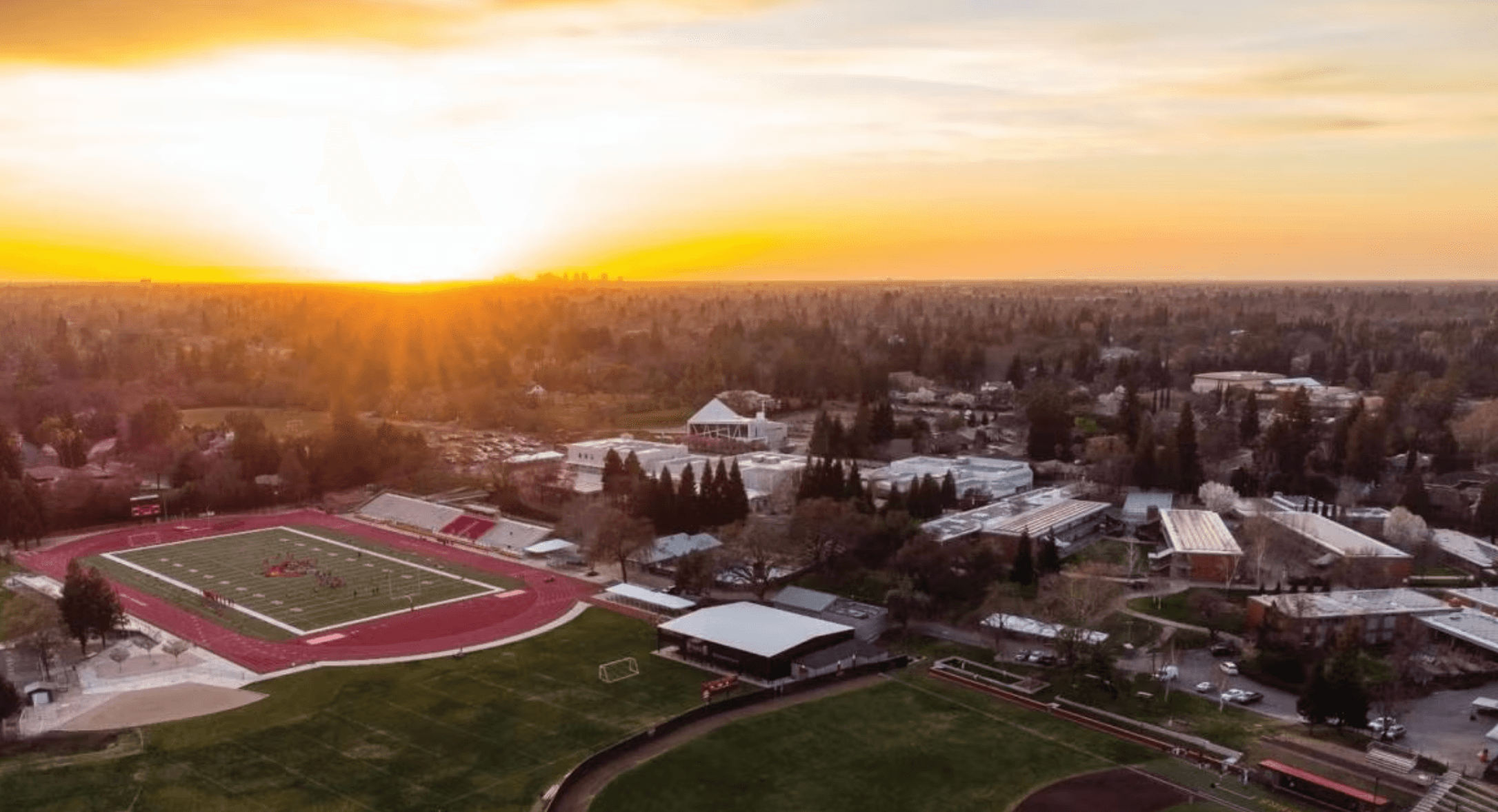 Aerial view of the Jesuit High School campus at sunset.